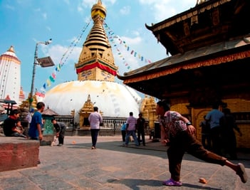IT'S ALL A GAME: Children enjoy the last days of school holidays by playing cricket at Swayambhu on Thursday afternoon.