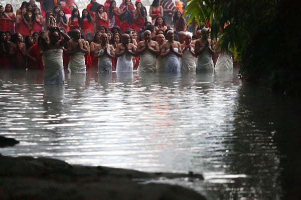 Devotees take a holy bath during the Swasthani Brata Katha festival at Sankhu on Sunday. During the month-long festival, devotees recite one chapter daily from the 31-chapter sacred Swasthani Brata Katha book that is dedicated to God Madhavnarayan and Goddess Swasthani.