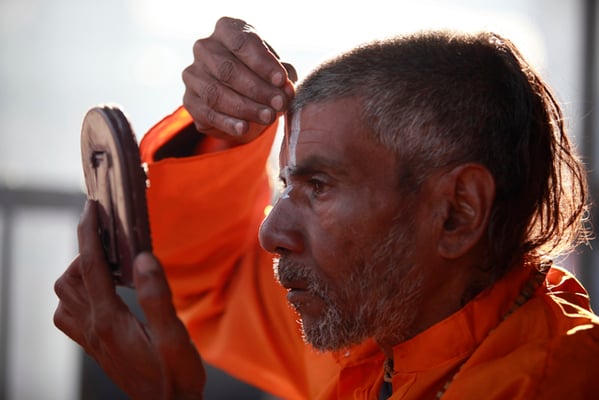 A holy man draws a sign on his forehead on Shiva Ratri, a day dedicated to the Hindu god of death and destruction, in Pashupatinath on Friday.