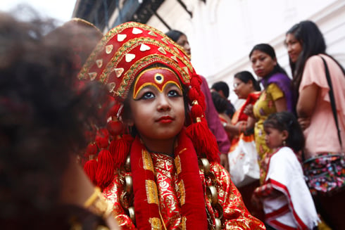 WAITING GAME: A girl dressed as a Kumari sits in line for the Kumari Puja at Hanuman Dhoka on Tuesday. Every year 504 girls are worshipped as part of the Indra Jatra festivities.