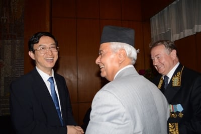 CONGRATULATIONS: Chinese ambassador Wu Chuntai (l) greets vice-president Parmanand Jha and Russian ambassador Sergey Velichkin (r) during Russia Day celebrations at Baluwatar on Wednesday.