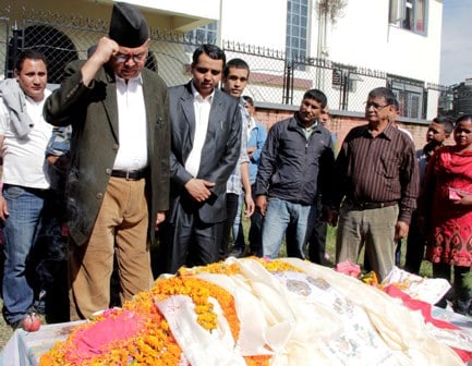 FALLEN COMRADE: Chairman of UML Jhalanath Khanal pays his last tributes to Shiva Raj Gautam, central advisor of the CPN-M who died of blood cancer.