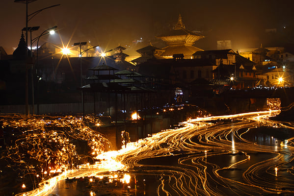Devotees light oil lamps in memory of their deceased family members during the Bala Chaturdashi festival at Pashupatinath Temple in Kathmandu on Monday.