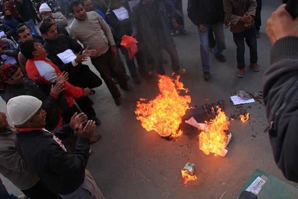 HOT PROTEST: CPN (UML) demonstrators burn the effigy of Prime Minister Baburam Bhattarai demanding the arrest of suspected murderers of journalist Dekendra Thapa, at Bagbazar on Tuesday.