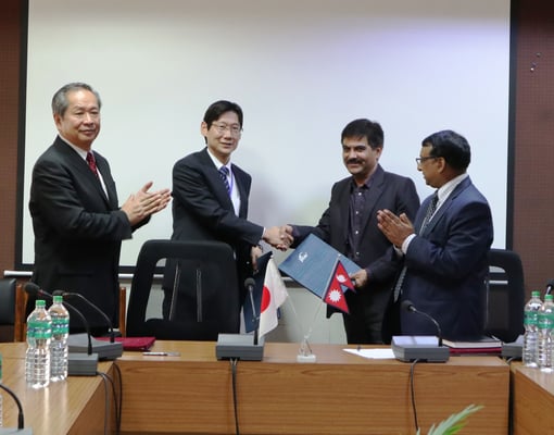 Joint Secretary Baikuntha Aryal (second from right) and JICA Nepal's Chief Representative Jun Sakuma (second from left) sign an agreement on a Rs 257 million scholarship program at Singha Darbar on Friday. Under this two-year program, 20 Nepali government officers will get to study in Japan.