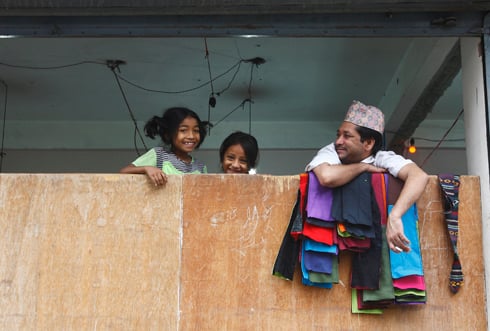 HAPPINESS IS BEING TOGETHER: A garments worker takes time out to chat with the children of his colleagues at Naya Bazar on Saturday.