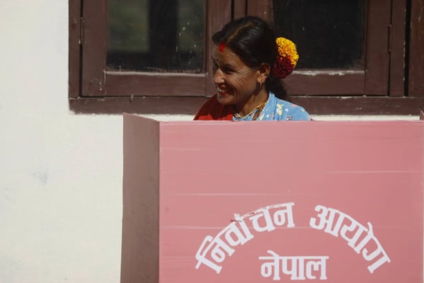 A woman casts her ballot in Balefi, Sindhupalchok on Sunday. Three million Nepalis from 32 hill and mountain districts are expected to cast their votes during the first phase of parliamentary and provincial elections