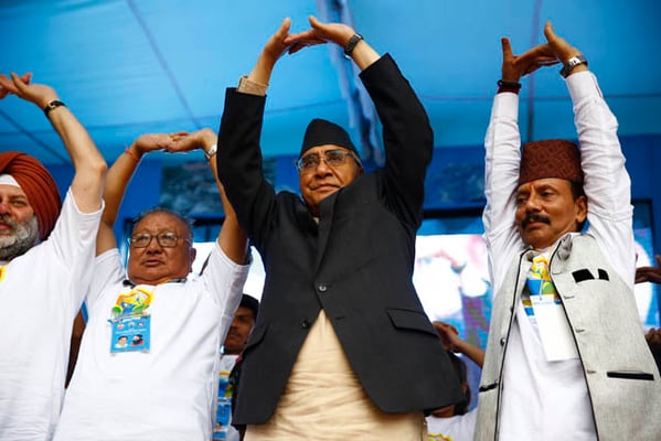 Prime Minister Sher Bahadur Deuba and Deputy Prime Minister Gopal Man Shrestha perform yoga poses during an event to mark the International Yoga Day in Bhrikutimandap on Wednesday.