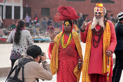 SAY CHEESE: Two ascetics pose for photos for a visitor at Basantapur on Thursday.