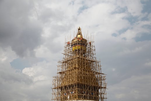 Labourers work to fix the damaged Boudhanath Stupa on Tuesday, nearly two months after the April 25 earthquake in Kathmandu.
