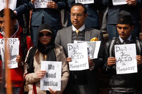 Acid attack victim Bindabasini Kansakar (second, left) with Mega Bank CEO Anil Shah at a protest rally against acid attacks at Basantapur on Tuesday.