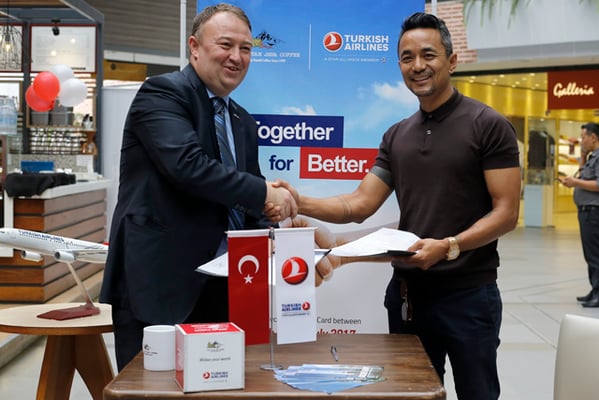 Turkish Airlines country manager Abdullah Tuncer (left) and Anand Gurung (right) of Himalayan Java shake hands after signing the memorandum of understanding for a year-long joint branding campaign at Labim Mall on Tuesday.