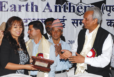 SONG OF JOY: Indian ambassador Jayanta Prasad (right) presents a memento to Shreya Sotang (left) for lending her voice to Earth Anthem at Hyatt Hotel on Tuesday.
