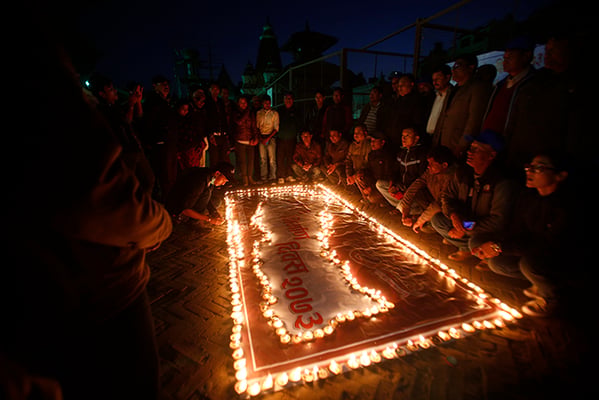 People light oil lamps to mark the 9th National Construction Day in Patan Darbar Square on Wednesday.
