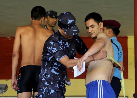 VITAL STATS: A candidate applying for the post of inspector gets his measurements taken at Police Academy Maharajgunj on Wednesday.