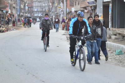 NO INTERFERENCE: Cyclists near New Baneswor take to the road after the strike at 5pm on Tuesday.
