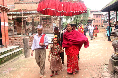 The kumari takes a walk near Nag Pokhari on Ghatasthapana in Bhaktapur .