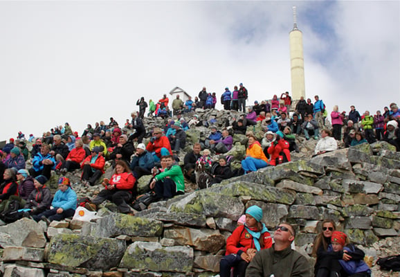 People attend the inauguration of stone steps repaired by a Nepali team along the hiking trail to the summit of Gaustadtoppen in Norway on Saturday.