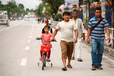 EMPTY LANE: A girl cycles in Ratna Park on Sunday during the banda called by opposition parties in protest of the announcement of date for CA elections.