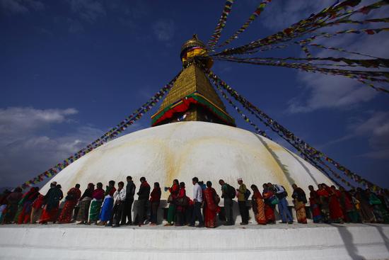 People from the Tamang community queue to offer butter lamps in the name of their deceased family members on the occasion of Temal Jatra in Boudhanath on Friday.