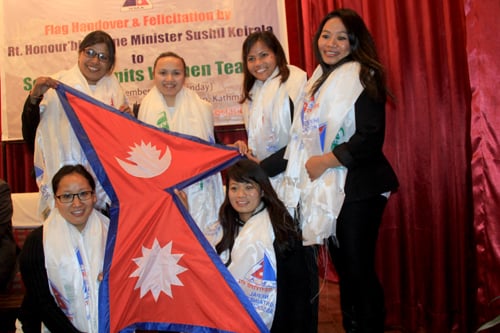 Members of the Seven Summits Women team carry the Nepali flag before their next expedition to scale Mt Vinson Massif in Antarctica on December.