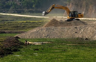 MEN AT WORK: A dozer fills up wetlands around Harpan Khola, one of the main sources that feeds Phewa Lake.