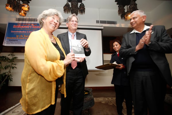 Swiss Ambassador Jorg Frieden (centre) launches the Nepali version of Toni Hagen's book 'Aid, Technology & Development' in Dwarika's Hotel on Tuesday. Also in the picture are Hagen's daughter Katrina (left) and Toni Hagen Foundation's Pramod Jha (right).