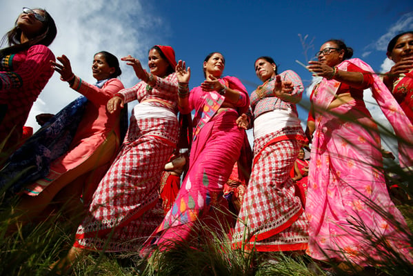 Women sing and dance on the occasion of Gaura Festival at Tudhikhel on Tuesday. On this day, women worship the goddess Gauri .