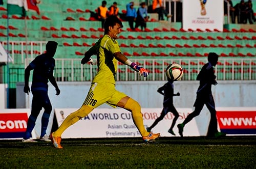 Nepali goalkeeper Kiran Chemjong clears the ball during the 2018 FIFA World Cup Qualifier match between Nepal and India at Dasarath Stadium,Kathmandu on Tuesday.