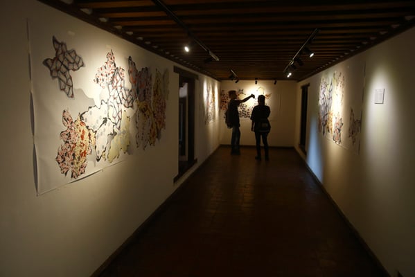 Visitors take a selfie with the artwork at the True Stories Project, an art exhibition against exploitation and human trafficking being held at Patan Museum on Thursday.