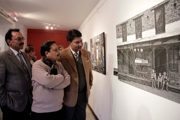 REAL TO SURREAL: Visitors at the exhibition of Iranian photographers Somaye Farhan and Soha Ebrahim Zandi in Siddhartha Art Gallery on Sunday.