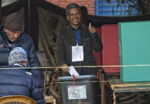 Rabindra Mishra of Bibeksheel Sajha Party casts his vote from Lalitpur-2 during the last phase of parliamentary and provincial elections on Thursday.