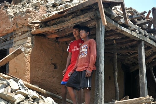 Two young boys at their house damaged by the earthquake in Kadambas village of Sindhupalchok district.