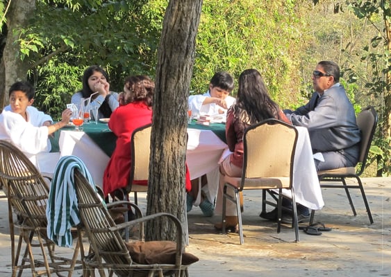 Ex-King Gyanendra with his family enjoys lunch at a resort at Kasara in Chitwan National Park on Monday, while in Kathmandu the constitution is deadlocked.