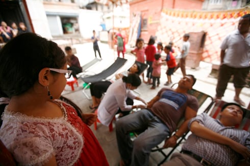 FUTURE DONOR: A young girl watches as her father donates blood at a program organised by Red Cross Society in Teku on Saturday.