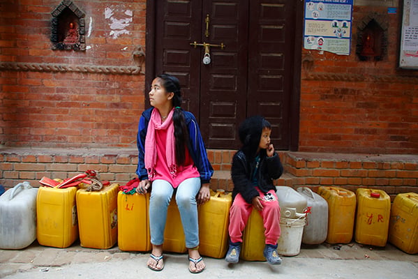 Children eagerly wait in line to fill water in Chyasal, Patan on Wednesday. As Nepal marks the 24th World Water Day many citizens still struggle with access to water for drinking and daily use.