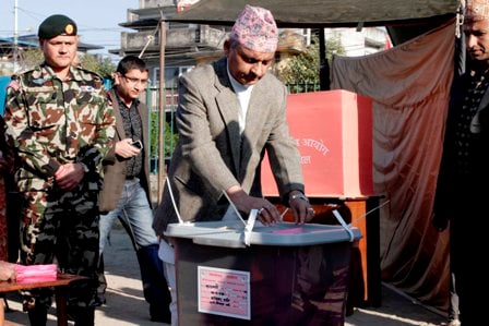 VIP VOTE: Chairman of Interim Election Council Khil Raj Regmi casts his vote from a polling centre in Gaucharan.