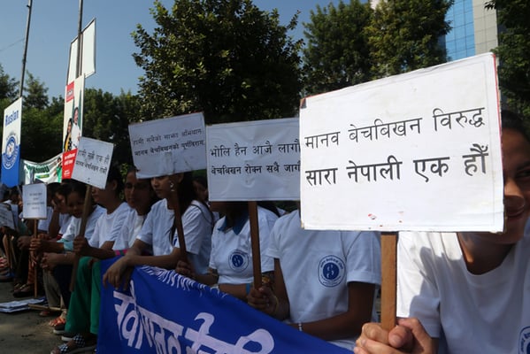 Participants attend a rally organised to protest against human trafficking at Pragya Bhawan in Kamaladi on Sunday.