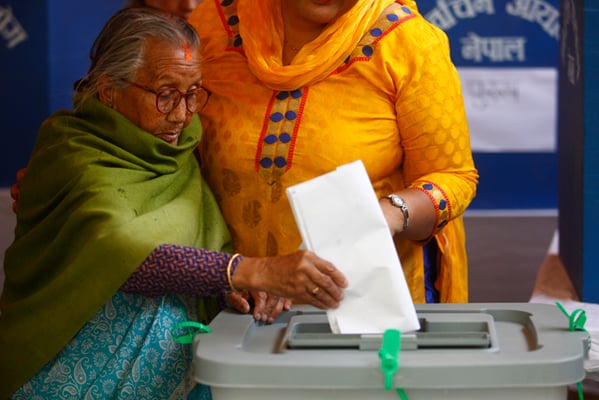 92-year-old Ram Kumari Shrestha casts her vote from Lalitpur during the first phase of the local elections on Sunday.