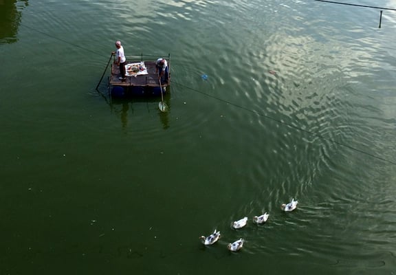 Locals cleaning the pond in Pim Bahal in Patan on Thursday.