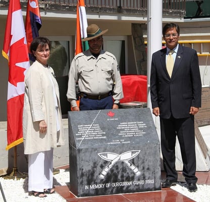 Canadian Ambassador Deborah Lyons (L) and Indian Ambassador Manpreet Vohra (R) unveil a permanent memorial to 13 Nepali and two Indian guards killed in a terrorist attack in Kabul last month.