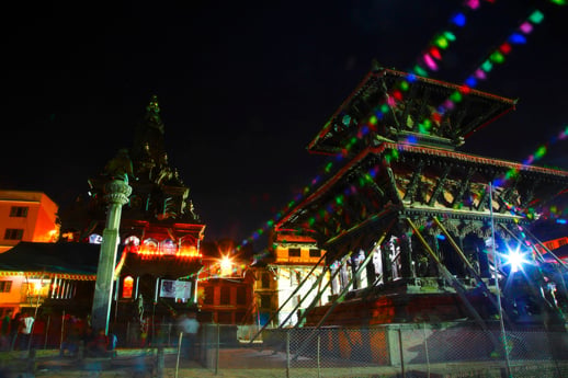 Confetti flags decorate the Krishna Mandir on the eve of Krishna Janmashtami at Patan Darbar Square on Friday.