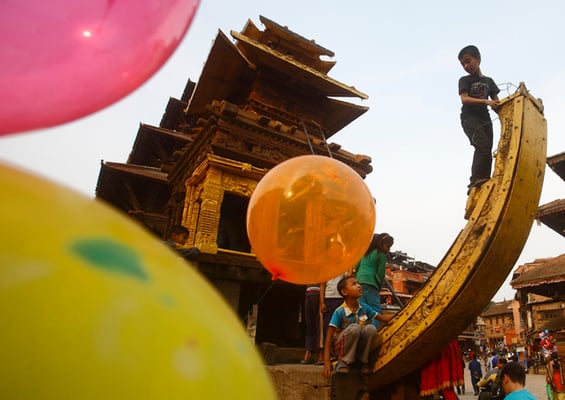 Children play on the chariot of Bhairab in Bhaktapur Darbar Square on Monday.The chariot is being decorated for the upcoming Bisket Jatra Festival held annually to celebrate the Nepali New Year.