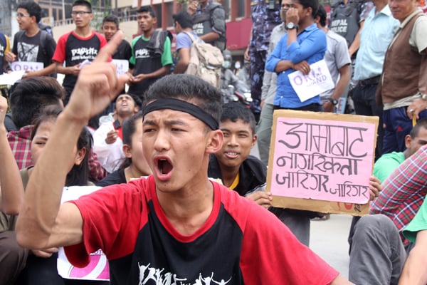 Sujan Limbu shouts slogans demanding citizenship through mother's name during a protest rally organised by women rights activists in Baneshwor, Kathmandu on Friday. He says he wants citizenship through the name of his mother, Indira Limbu.