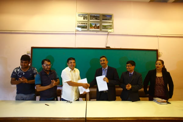 Bikash Karki of the Photojournalist Club and Dip Panday of Shikar Insurance at a press meet announcing health and camera insurance for photo journalists at Nepal Tourism Board, Kathmandu on Wednesday.