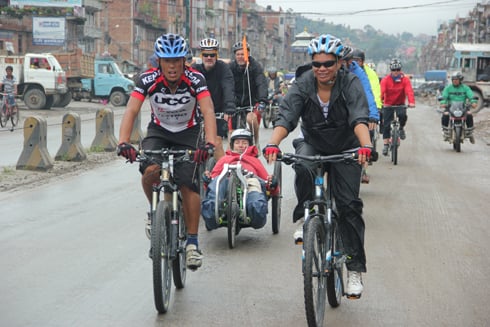 HECK OF A JOURNEY: Catriona Williams (centre) and her team arrive in Banepa on Monday as they finish their fundraising ride from Lhasa to Kathmandu.