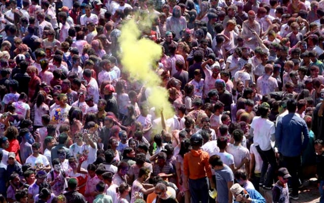 People celebrate Holi on the streets of Basantapur on Sunday.