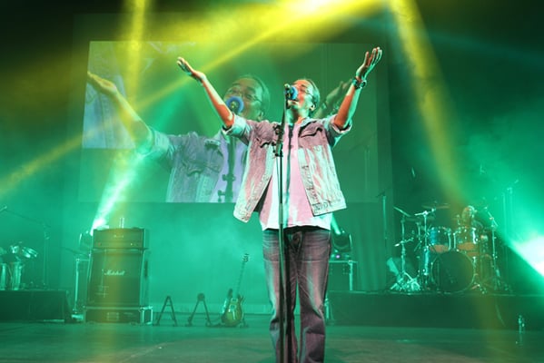 Amrit Gurung, lead vocalist of Nepali band Nepathya, performs on the stage of Yuen Long Theatre with his band members in Hong Kong on Monday.