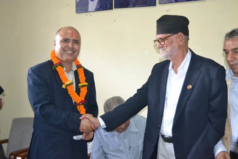WELCOME: Former finance secretary Rameshwor Khanal joined the Nepali Congress on Monday. NC President Shusil Koirala welcomed Khanal amid a special function at the party office in Sanepa.