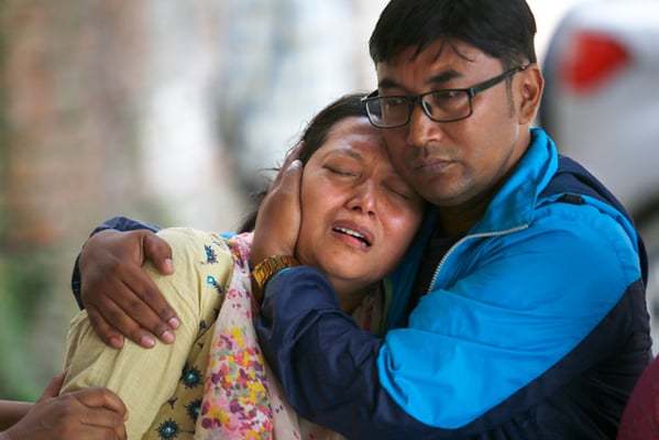 Family members of the pilot and co-pilot of Goma Airlines airplane which crashed near Tenzing Hillary airport in Lukla on Saturday, mourn over their bodies at the Tribhuvan University Teaching Hospital in Kathmandu on Sunday.